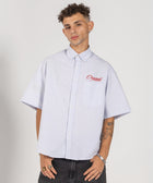 Unisex button-up shirt with a boxy fit and midi crop, featuring sailor stripes in ocean blue and white. Embroidered "Humble State of Mind" logo in burgundy red on the back and "Originals" embroidery on the front. Made from 100% thick cotton for a relaxed, summery style.