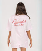 Unisex button-up shirt with a boxy fit and midi crop, featuring sailor stripes in rose pink and white. Embroidered "Humble State of Mind" logo in burgundy red on the back and "Originals" embroidery on the front. Made from 100% thick cotton for a relaxed, summery style.
