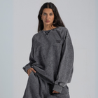 Model wearing the BROWNTOAST ASSID Crewneck Sweatshirt from the ASSID Collection — unisex cotton-blend crewneck with relaxed fit and unique acid stone wash dye variations. Made in Egypt, each piece is one of a kind, combining individuality and streetwear comfort.