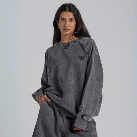 Model wearing the BROWNTOAST ASSID Crewneck Sweatshirt from the ASSID Collection — unisex cotton-blend crewneck with relaxed fit and unique acid stone wash dye variations. Made in Egypt, each piece is one of a kind, combining individuality and streetwear comfort.