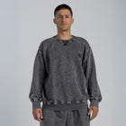 Model wearing the BROWNTOAST ASSID Crewneck Sweatshirt from the ASSID Collection — unisex cotton-blend crewneck with relaxed fit and unique acid stone wash dye variations. Made in Egypt, each piece is one of a kind, combining individuality and streetwear comfort.