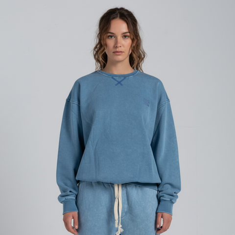 Model wearing the BROWNTOAST ASSID Crewneck Sweatshirt from the ASSID Collection — unisex cotton-blend crewneck with relaxed fit and unique acid stone wash dye variations. Made in Egypt, each piece is one of a kind, combining individuality and streetwear comfort.