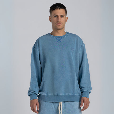 Model wearing the BROWNTOAST ASSID Crewneck Sweatshirt from the ASSID Collection — unisex cotton-blend crewneck with relaxed fit and unique acid stone wash dye variations. Made in Egypt, each piece is one of a kind, combining individuality and streetwear comfort.