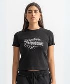 Women’s cropped black baby tee in cotton-lycra with faded grey Breakdown of Systems chest print.