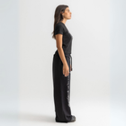 Women’s cropped black baby tee in cotton-lycra with faded grey Breakdown of Systems chest print.