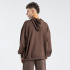 Model wearing the BROWNTOAST Core Full Zip Up Jacket from the Core Drop — a relaxed unisex hoodie with a dual zipper and adjustable hood. Made in Egypt from soft cotton, combining everyday comfort with effortless street style.