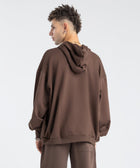 Model wearing the BROWNTOAST Core Full Zip Up Jacket from the Core Drop — a relaxed unisex hoodie with a dual zipper and adjustable hood. Made in Egypt from soft cotton, combining everyday comfort with effortless street style.