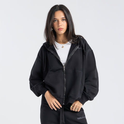 Model wearing the BROWNTOAST Core Full Zip Up Jacket from the Core Drop — a relaxed unisex hoodie with a dual zipper and adjustable hood. Made in Egypt from soft cotton, combining everyday comfort with effortless street style.