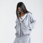 Model wearing the BROWNTOAST Core Full Zip Up Jacket from the Core Drop — a relaxed unisex hoodie with a dual zipper and adjustable hood. Made in Egypt from soft cotton, combining everyday comfort with effortless street style.