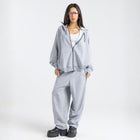 Model wearing the BROWNTOAST Core Full Zip Up Jacket from the Core Drop — a relaxed unisex hoodie with a dual zipper and adjustable hood. Made in Egypt from soft cotton, combining everyday comfort with effortless street style.