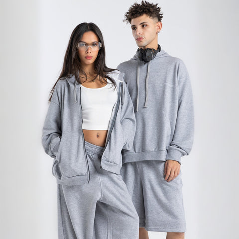 Model wearing the BROWNTOAST Core Full Zip Up Jacket from the Core Drop — a relaxed unisex hoodie with a dual zipper and adjustable hood. Made in Egypt from soft cotton, combining everyday comfort with effortless street style.