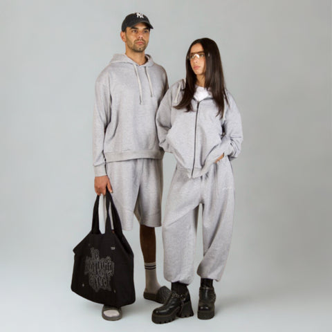 Model wearing the BROWNTOAST Core Full Zip Up Jacket from the Core Drop — a relaxed unisex hoodie with a dual zipper and adjustable hood. Made in Egypt from soft cotton, combining everyday comfort with effortless street style.