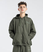Model wearing the BROWNTOAST Core Full Zip Up Jacket from the Core Drop — a relaxed unisex hoodie with a dual zipper and adjustable hood. Made in Egypt from soft cotton, combining everyday comfort with effortless street style.