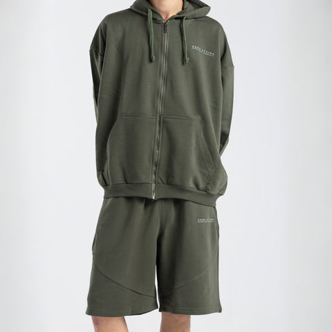 Model wearing the BROWNTOAST Core Full Zip Up Jacket from the Core Drop — a relaxed unisex hoodie with a dual zipper and adjustable hood. Made in Egypt from soft cotton, combining everyday comfort with effortless street style.