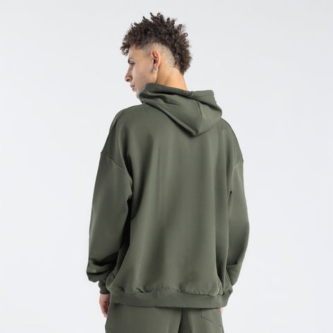 Model wearing the BROWNTOAST Core Full Zip Up Jacket from the Core Drop — a relaxed unisex hoodie with a dual zipper and adjustable hood. Made in Egypt from soft cotton, combining everyday comfort with effortless street style.