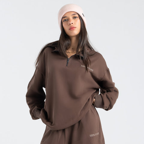 Core Quarter Zip Up sweatshirt in brown, front view showcasing relaxed boxy fit and minimal design.