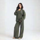 Core Quarter Zip Up sweatshirt in olive, front view showcasing relaxed boxy fit and minimal design.