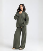 Core Quarter Zip Up sweatshirt in olive, front view showcasing relaxed boxy fit and minimal design.