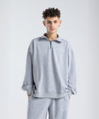 Core Quarter Zip Up sweatshirt in light grey, front view showcasing relaxed boxy fit and minimal design.