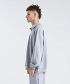 Core Quarter Zip Up sweatshirt in light grey, front view showcasing relaxed boxy fit and minimal design.