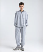Core Quarter Zip Up sweatshirt in light grey, front view showcasing relaxed boxy fit and minimal design.