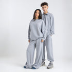 Core Quarter Zip Up sweatshirt in light grey, front view showcasing relaxed boxy fit and minimal design.