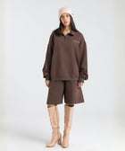 Core Quarter Zip Up sweatshirt in brown, front view showcasing relaxed boxy fit and minimal design.