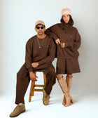 Core Quarter Zip Up sweatshirt in brown, front view showcasing relaxed boxy fit and minimal design.