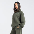 Core Quarter Zip Up sweatshirt in olive, front view showcasing relaxed boxy fit and minimal design.