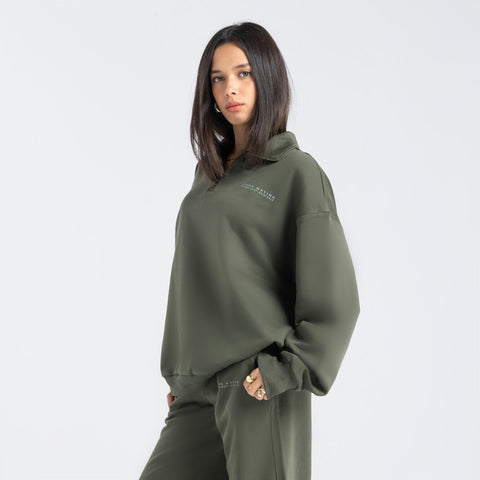 Core Quarter Zip Up sweatshirt in olive, front view showcasing relaxed boxy fit and minimal design.