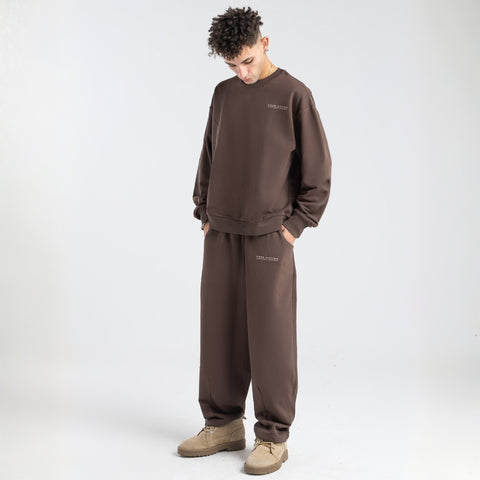 Model wearing the BROWNTOAST Core Crewneck from the Core Drop — a relaxed unisex sweatshirt with a classic crew neckline and front silk-screen print. Made in Egypt from a soft cotton-lycra blend for elevated everyday comfort and style.