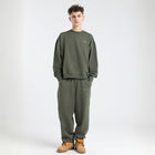 Model wearing the BROWNTOAST Core Crewneck from the Core Drop — a relaxed unisex sweatshirt with a classic crew neckline and front silk-screen print. Made in Egypt from a soft cotton-lycra blend for elevated everyday comfort and style.