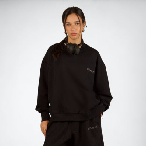 Model wearing the BROWNTOAST Core Crewneck from the Core Drop — a relaxed unisex sweatshirt with a classic crew neckline and front silk-screen print. Made in Egypt from a soft cotton-lycra blend for elevated everyday comfort and style.