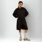 Model wearing the BROWNTOAST Core Crewneck from the Core Drop — a relaxed unisex sweatshirt with a classic crew neckline and front silk-screen print. Made in Egypt from a soft cotton-lycra blend for elevated everyday comfort and style.