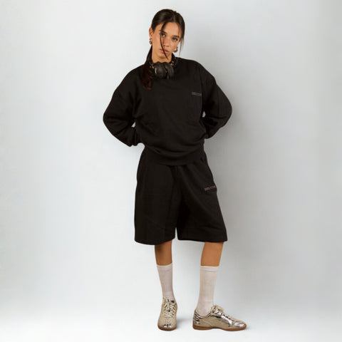 Model wearing the BROWNTOAST Core Crewneck from the Core Drop — a relaxed unisex sweatshirt with a classic crew neckline and front silk-screen print. Made in Egypt from a soft cotton-lycra blend for elevated everyday comfort and style.