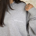 Model wearing the BROWNTOAST Core Crewneck from the Core Drop — a relaxed unisex sweatshirt with a classic crew neckline and front silk-screen print. Made in Egypt from a soft cotton-lycra blend for elevated everyday comfort and style.