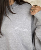 Model wearing the BROWNTOAST Core Crewneck from the Core Drop — a relaxed unisex sweatshirt with a classic crew neckline and front silk-screen print. Made in Egypt from a soft cotton-lycra blend for elevated everyday comfort and style.