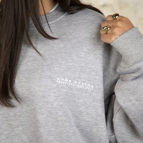 Model wearing the BROWNTOAST Core Crewneck from the Core Drop — a relaxed unisex sweatshirt with a classic crew neckline and front silk-screen print. Made in Egypt from a soft cotton-lycra blend for elevated everyday comfort and style.