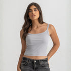 Grey ribbed spaghetti tank styled with denim jeans for a casual everyday outfit.