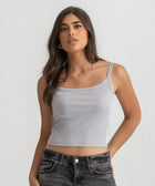 Grey ribbed spaghetti tank styled with denim jeans for a casual everyday outfit.