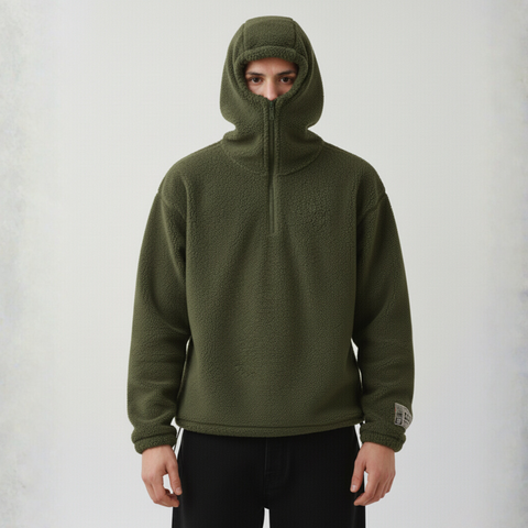 Model wearing the BROWNTOAST Anonymous Attire Polar Fleece Masked Hoodie — unisex fleece hoodie with full-zip masked hood, drop shoulders, patch detailing, and adjustable side clasps. Made in Egypt from 100% polar fleece for warmth and street-ready edge.