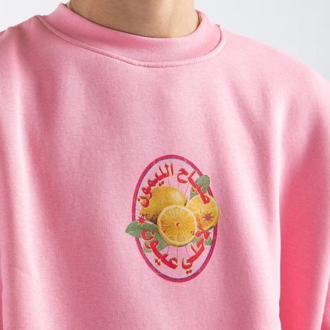 Sabah El Lamoon Morning Market sweatshirt – pink boxy midi cropped fit with colorful silk-screen front print, BTX x Nada Sultan