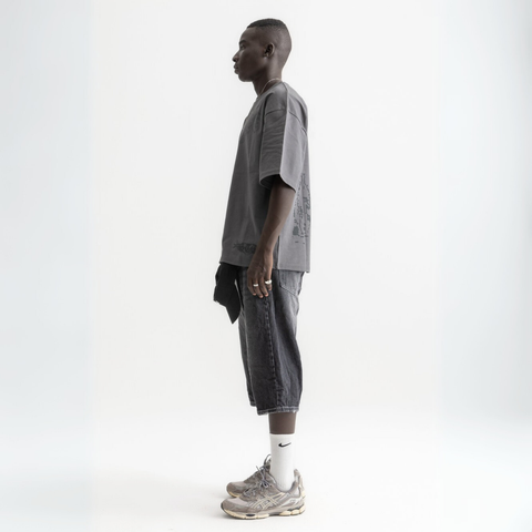 Unisex washed grey box-fit tee in heavyweight Egyptian cotton with skeletal spine and distorted ECHOES text on chest, abstract designs on back.