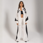 Model wearing the BROWNTOAST Compton Tracksuit Jacket — unisex oversized polyester track jacket with a dual-function zipper and BTO rubber and embroidered logos. Inspired by old-school Compton style and 80s hip-hop culture. Available in black and white.