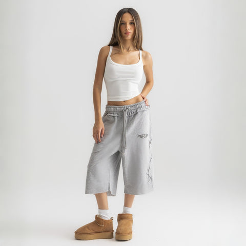 White ribbed spaghetti tank styled with denim jeans for a casual everyday outfit.