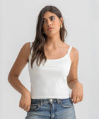 White ribbed spaghetti tank styled with denim jeans for a casual everyday outfit.