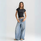 Women’s ribbed short sleeve top made from 95% cotton and 5% lycra. Features a fitted silhouette for a flattering, comfortable fit. Soft and breathable fabric with a versatile design for layering or wearing on its own.