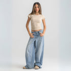 Women’s ribbed short sleeve top made from 95% cotton and 5% lycra. Features a fitted silhouette for a flattering, comfortable fit. Soft and breathable fabric with a versatile design for layering or wearing on its own.