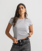 Women’s ribbed short sleeve top made from 95% cotton and 5% lycra. Features a fitted silhouette for a flattering, comfortable fit. Soft and breathable fabric with a versatile design for layering or wearing on its own.