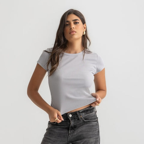 Women’s ribbed short sleeve top made from 95% cotton and 5% lycra. Features a fitted silhouette for a flattering, comfortable fit. Soft and breathable fabric with a versatile design for layering or wearing on its own.